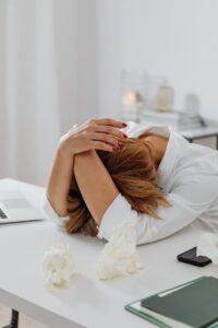 a stressed woman trying to write a resume
